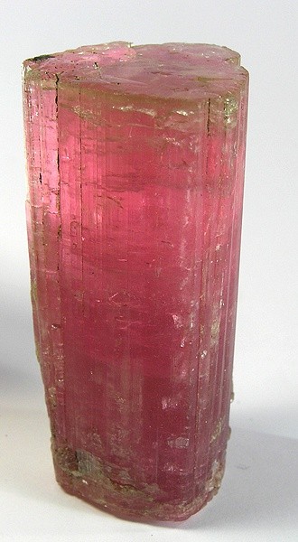A pink tourmaline crystal shown as a gemstone reference